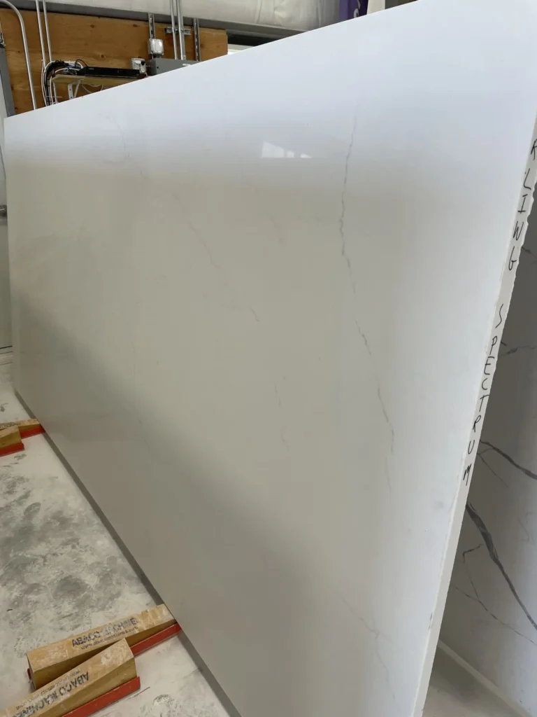 White marble slab with subtle veining for countertops or surfaces.